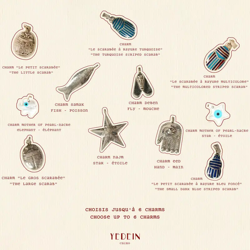 Les différents choix de charms sur fond crème pour le collier Abir Multicharms 